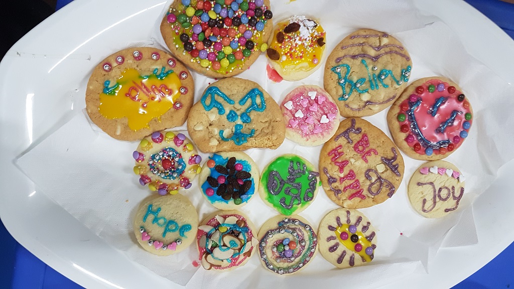 Colourfully decorated Plätzchen biscuits on a plate